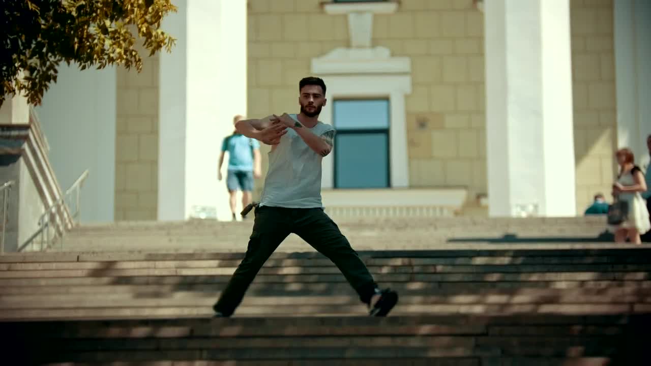 Free Video Stock Stylish Man With Tattoos Dancing On The Stairs Live Wallpaper