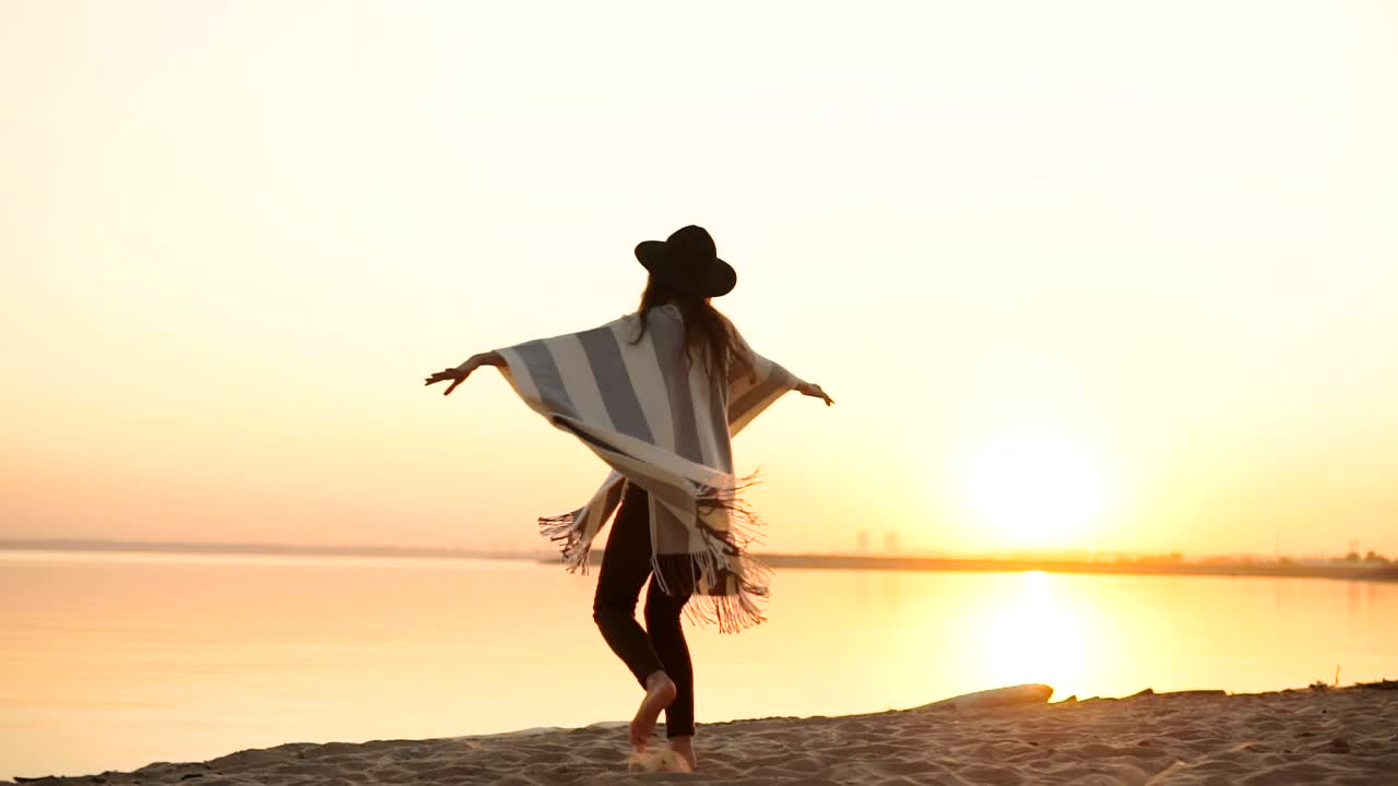 Free Video Stock Stylish Millennial Woman Spins On Beach At Sunset Live Wallpaper
