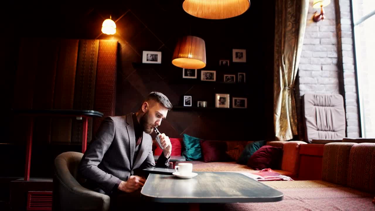 Free Video Stock Stylish Urban Man Vaping Hookah In Cafe Live Wallpaper