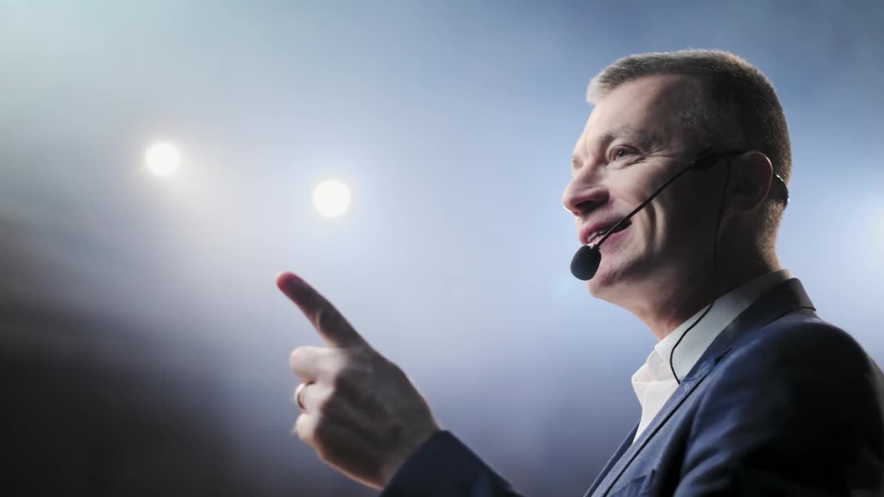 Free Video Stock Successful Lecturer Speaks Passionately On Stage Live Wallpaper