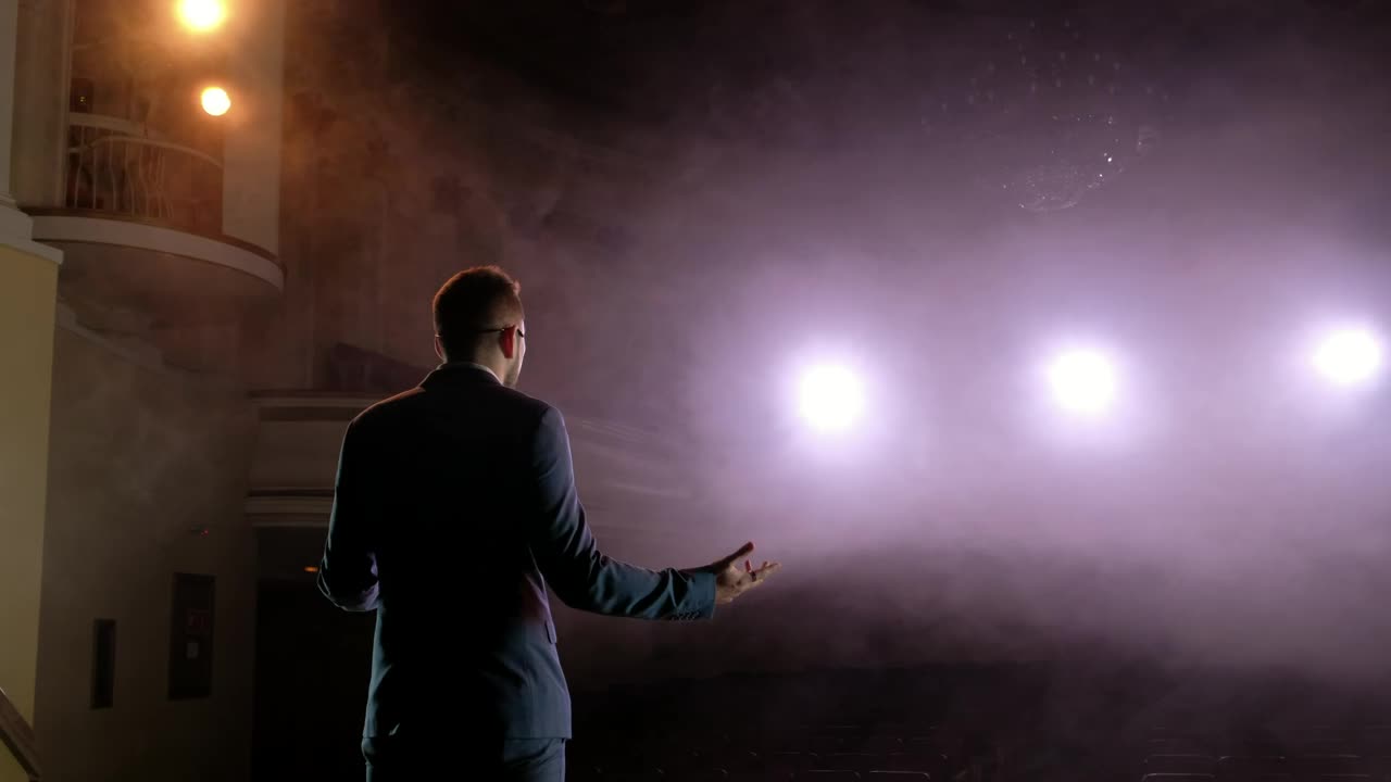 Free Video Stock Successful Speaker Practicing On An Empty Stage Live Wallpaper