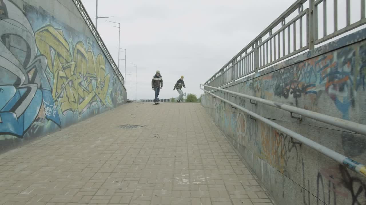 Free Video Stock Skateboarders In An Urban Area With Graffiti Live Wallpaper
