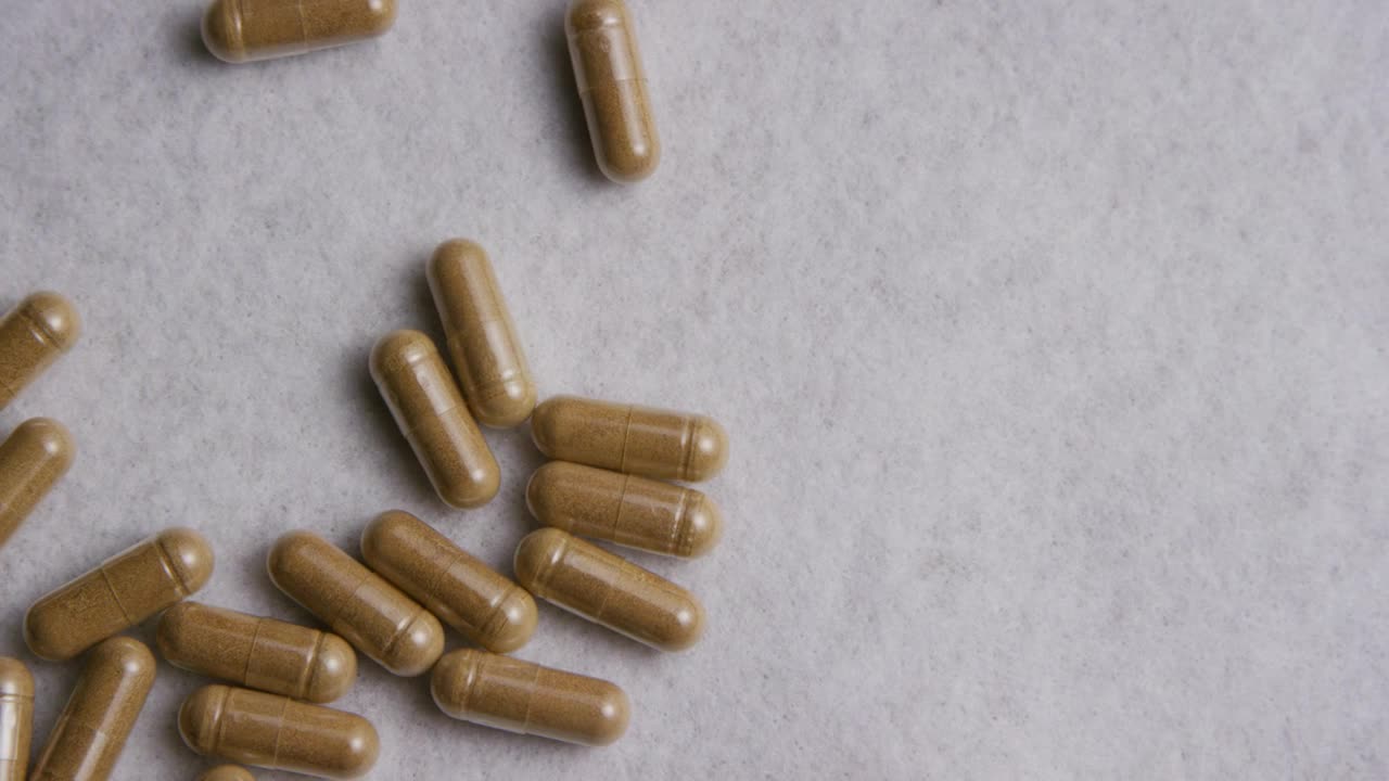 Free Video Stock transparent pills on a white surface Live Wallpaper