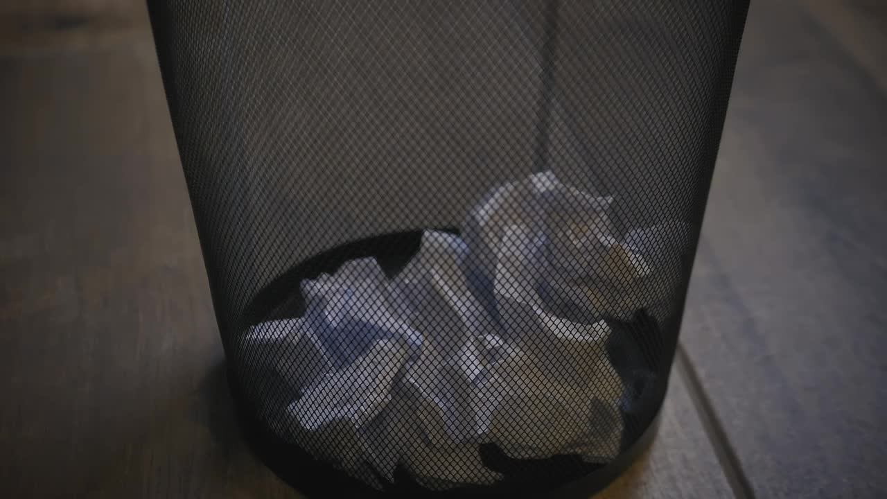 Free Video Stock trash basket of an office with paper balls Live Wallpaper