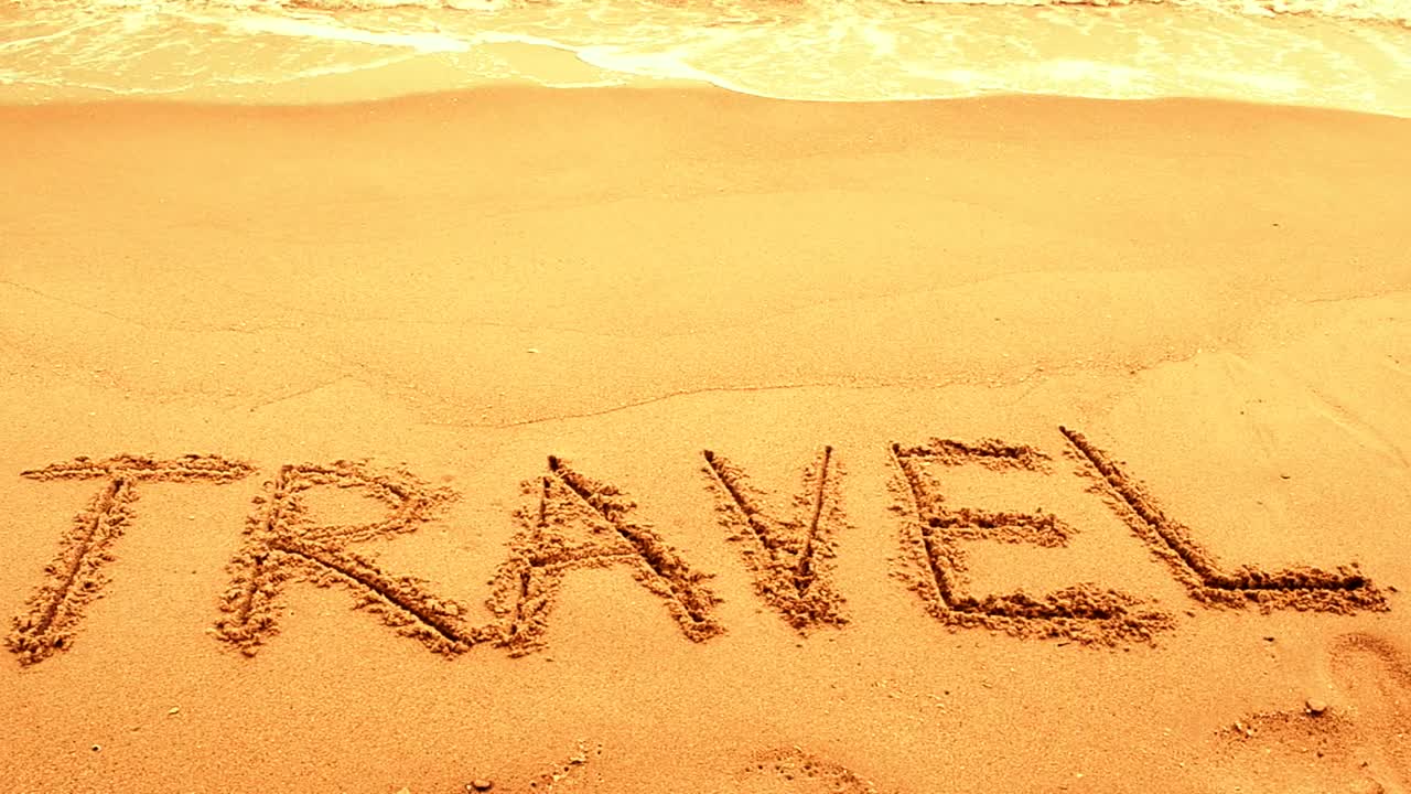 Free Video Stock travel written on golden sand Live Wallpaper