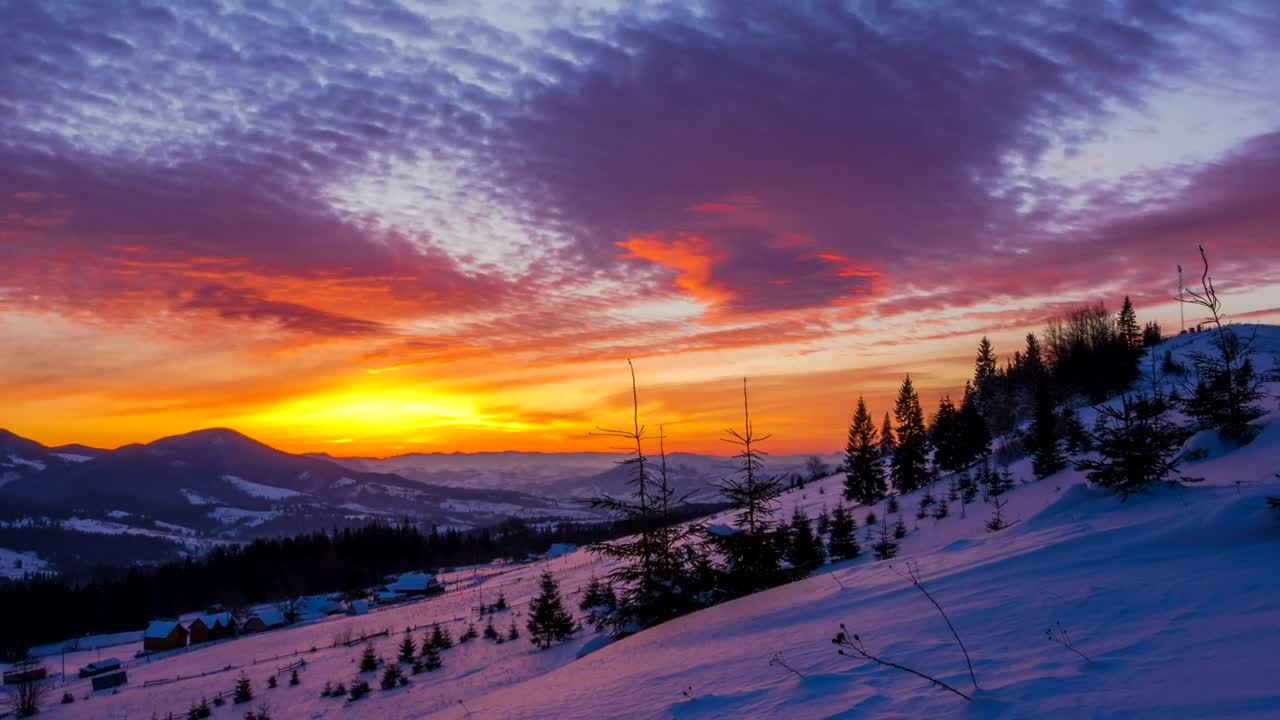 Free Video Stock sunrise over a winter mountain Live Wallpaper