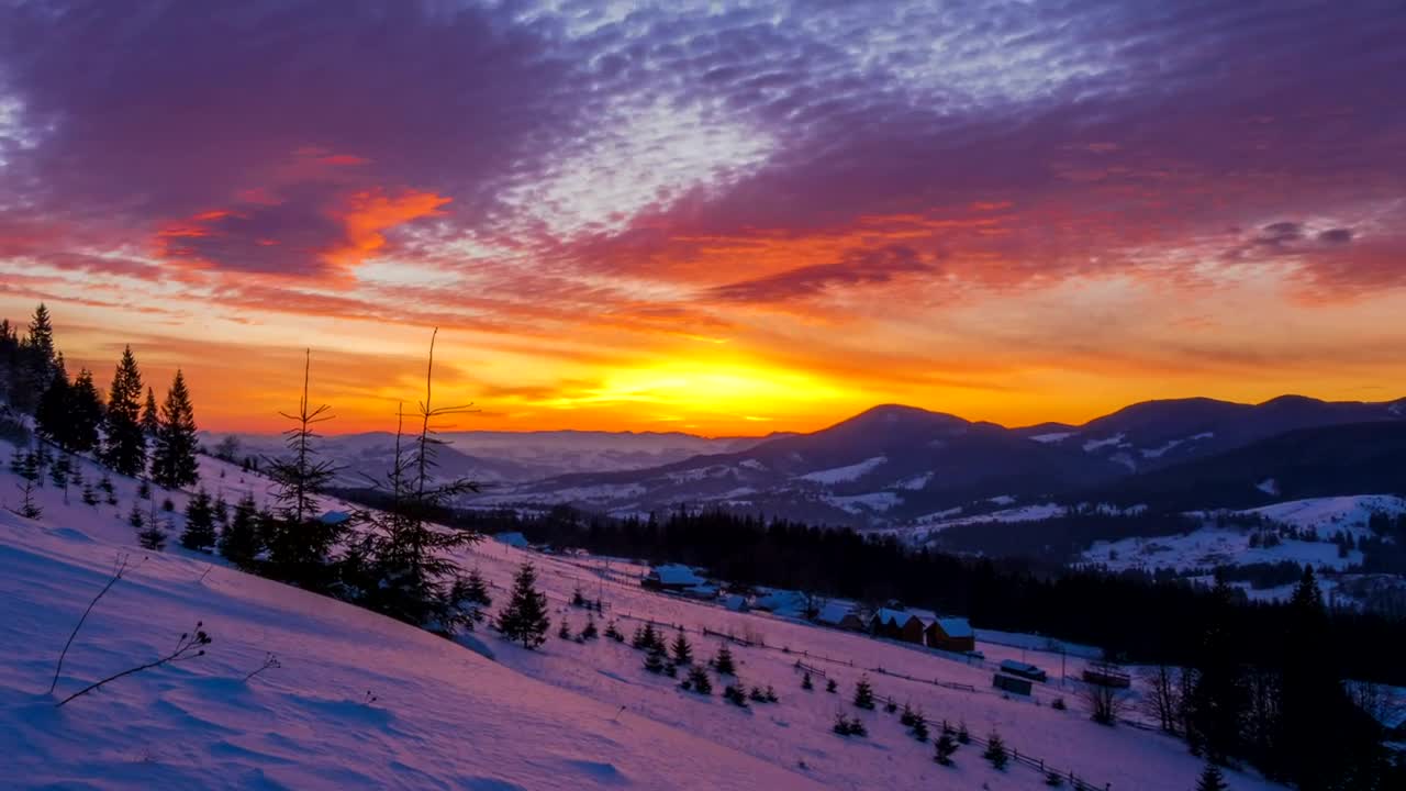 Free Video Stock sunset over a snowy winter mountain Live Wallpaper