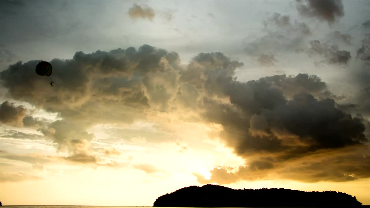 Free Video Stock sunset over a tropical island Live Wallpaper