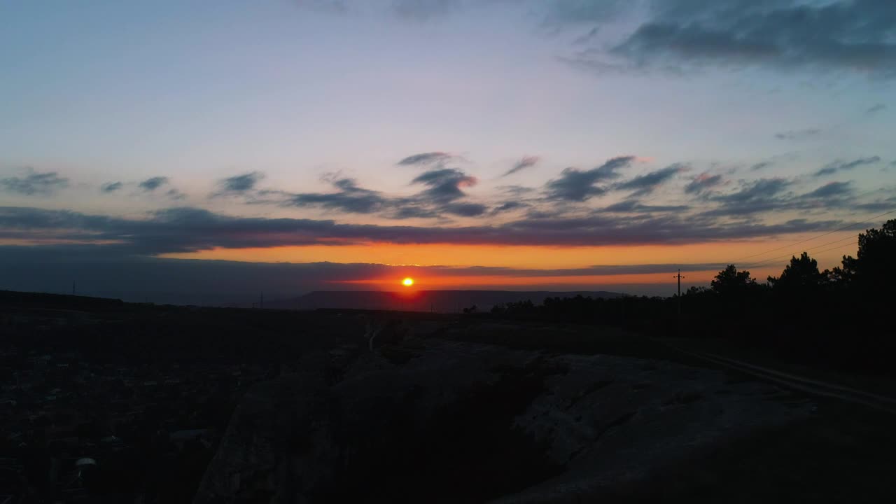 Free Video Stock sunset over dark scenery Live Wallpaper