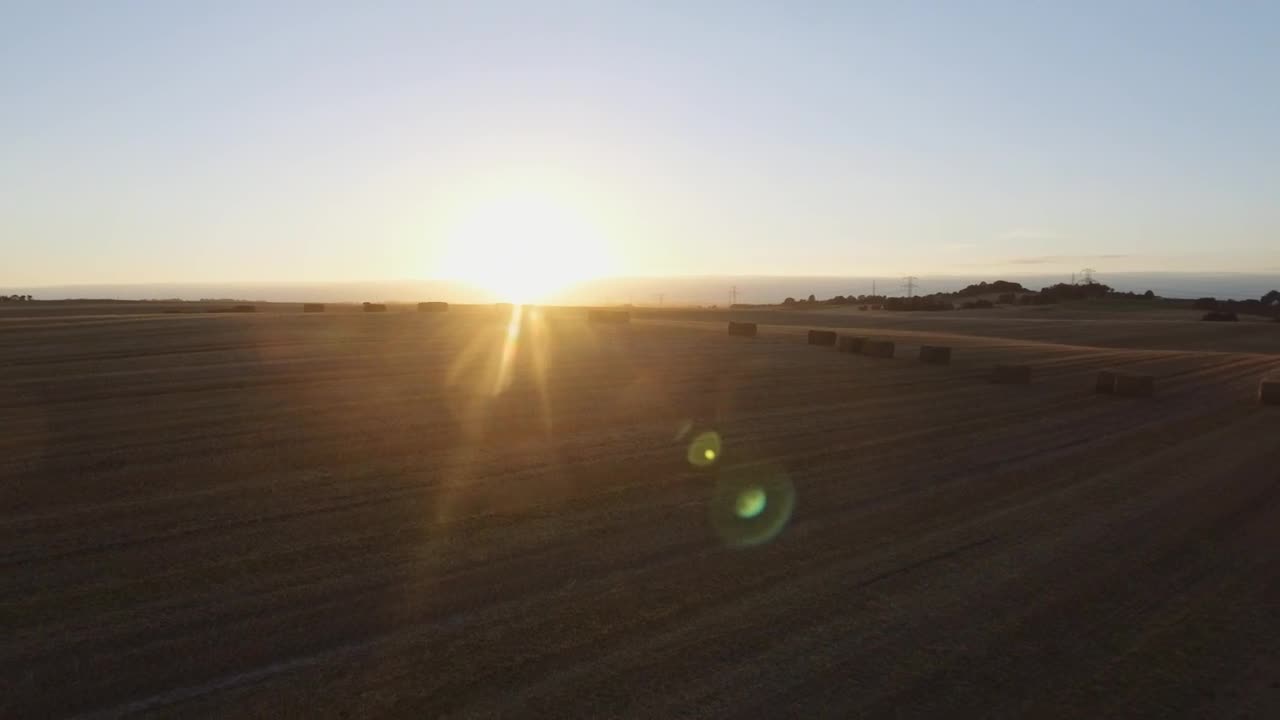 Free Video Stock sunset over harvested fields Live Wallpaper