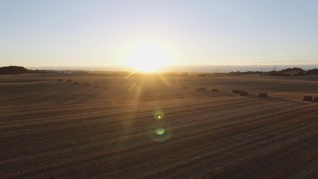 Free Video Stock sunset over harvested mountain fields Live Wallpaper