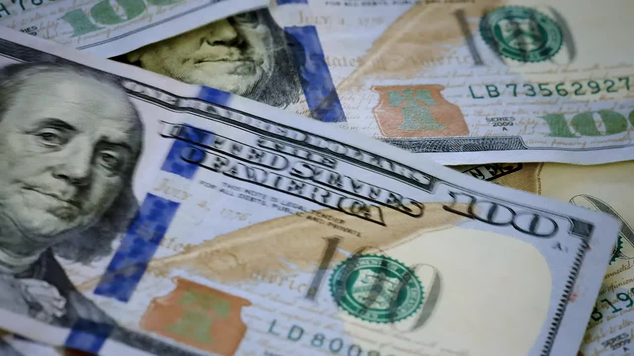 Free Video Stock surface while  dollar bills fall messily Live Wallpaper