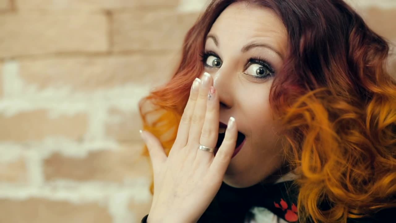 Free Video Stock surprised young woman covers her mouth Live Wallpaper