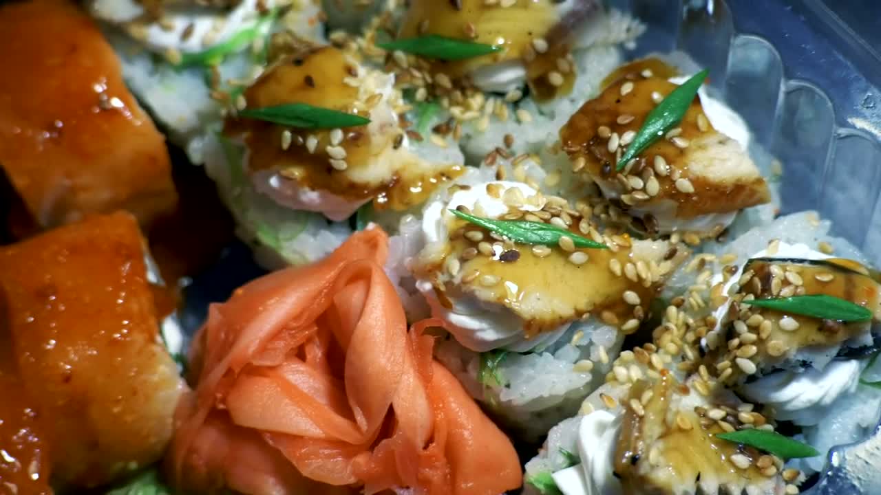 Free Video Stock sushi and chopsticks in plastic container Live Wallpaper