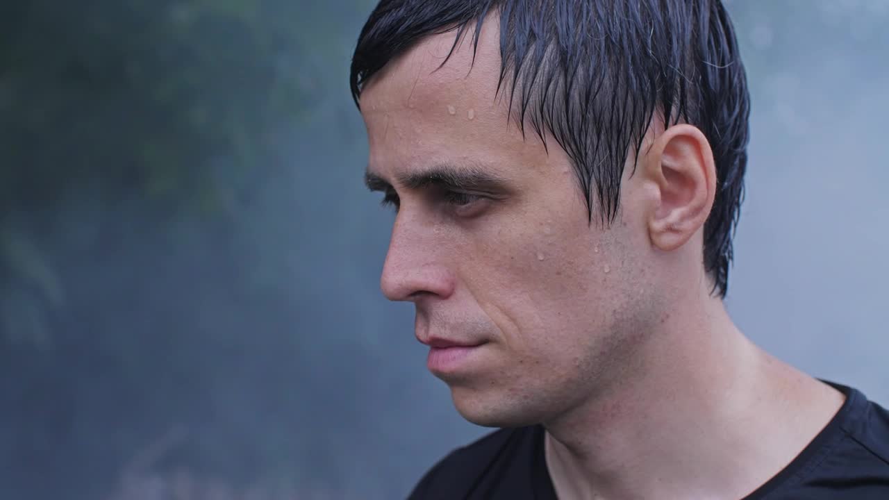 Free Video Stock sweaty man looks at the sky in smoke Live Wallpaper