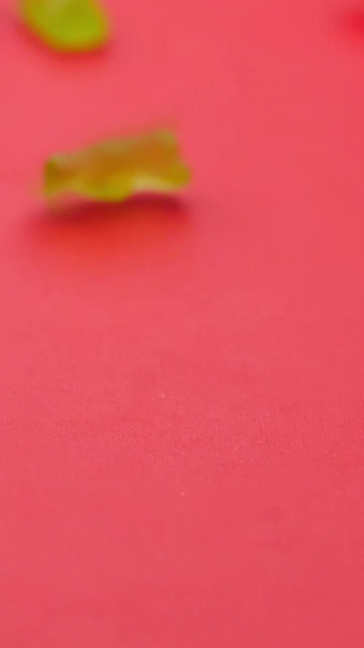 Free Video Stock sweets in the shape of pandas rolling on a pink Live Wallpaper