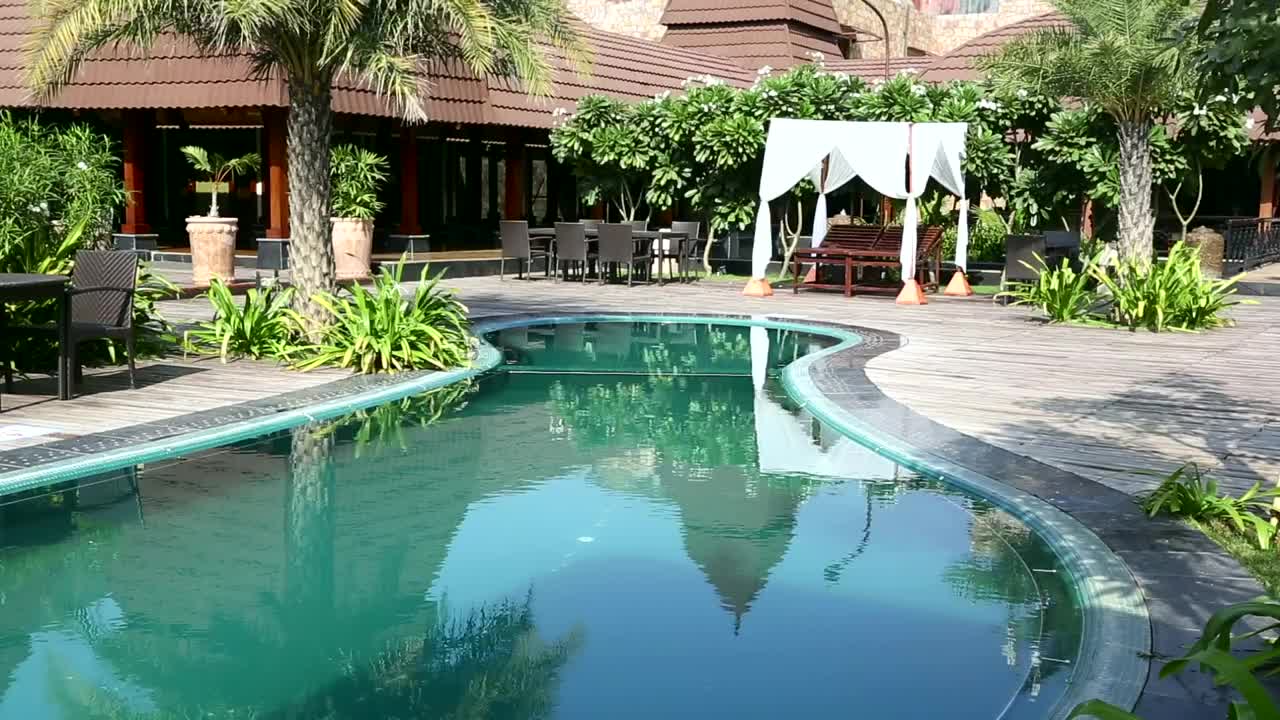 Free Video Stock swiming pool in resort garden Live Wallpaper