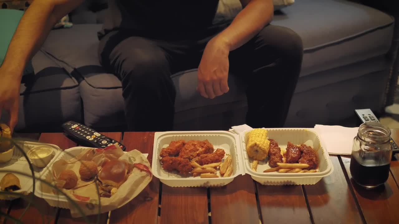 Free Video Stock table in a living room with fast food while a Live Wallpaper