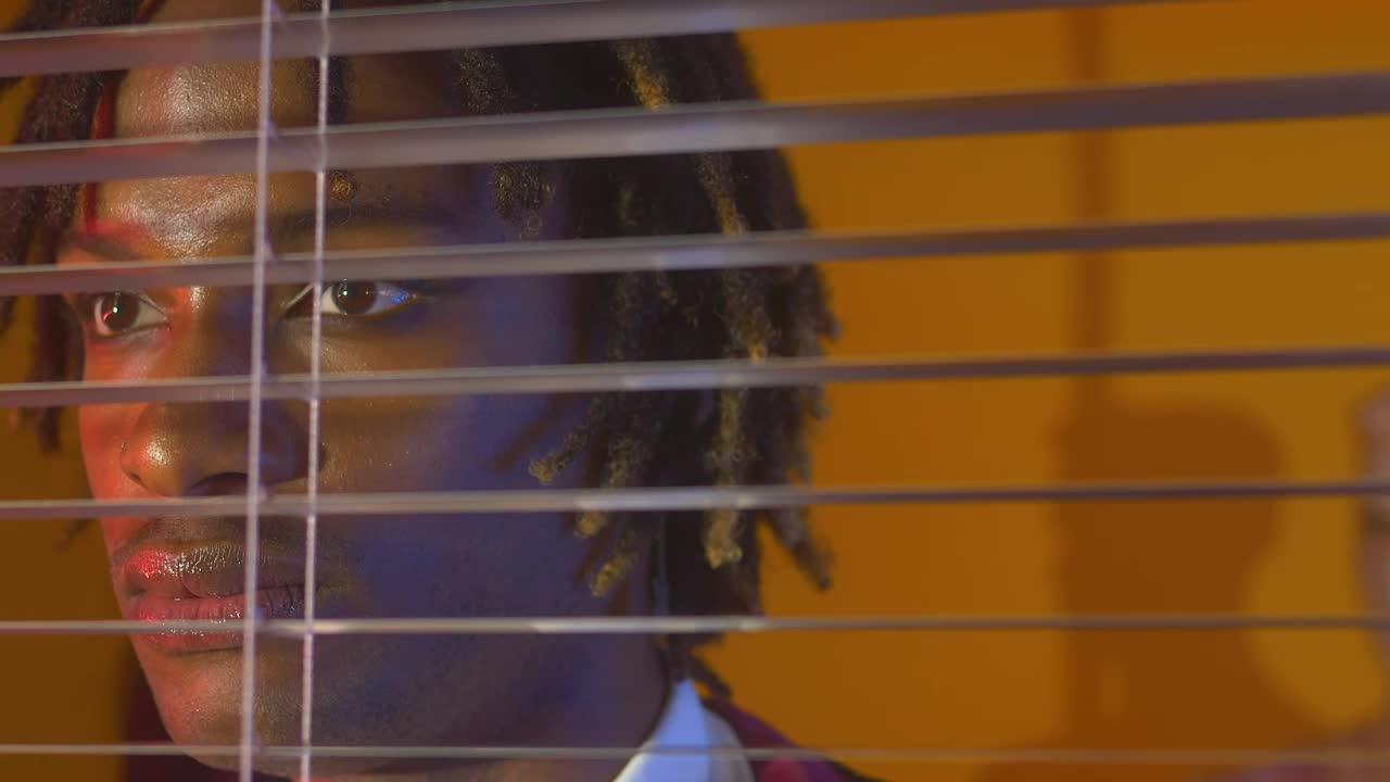 Free Video Stock taciturn face of a man through the window Live Wallpaper