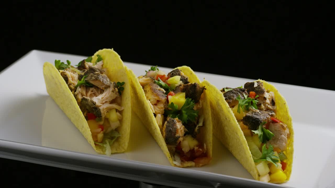 Free Video Stock tacos rotating on a plate on a black background Live Wallpaper