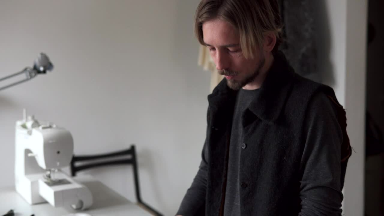 Free Video Stock tailor drawing a design for sewing Live Wallpaper