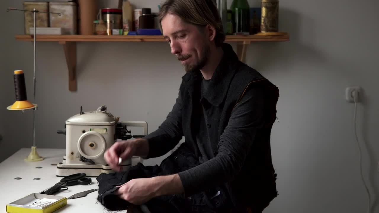 Free Video Stock tailor working in their shop Live Wallpaper