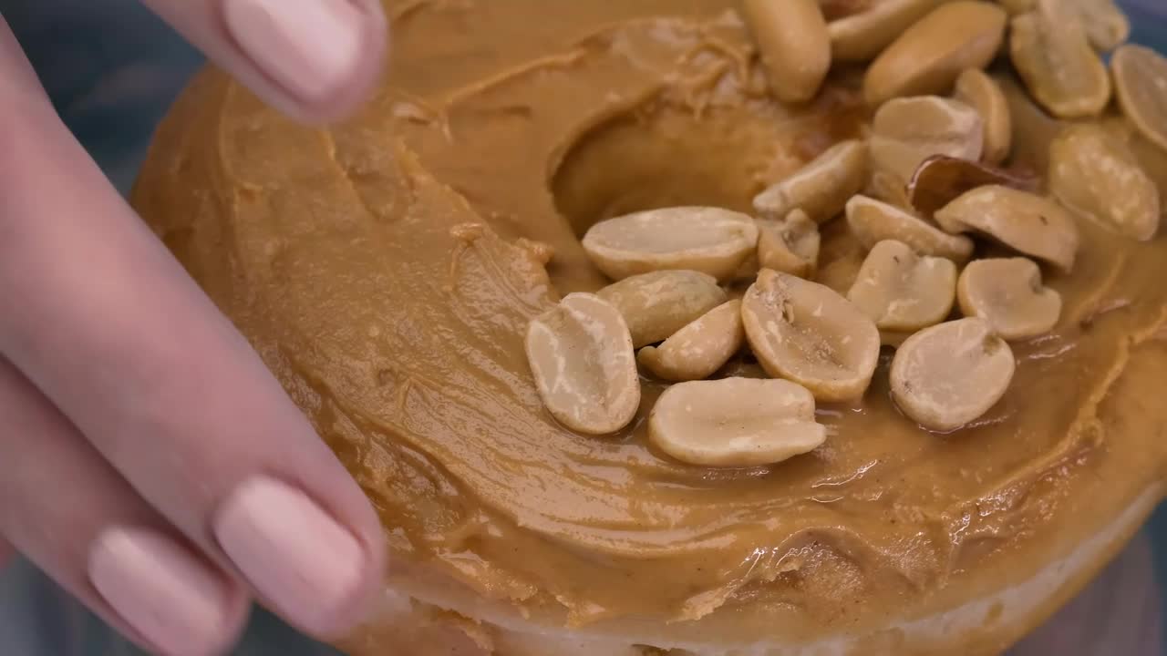 Free Video Stock taking a peanut butter donut from a plate Live Wallpaper