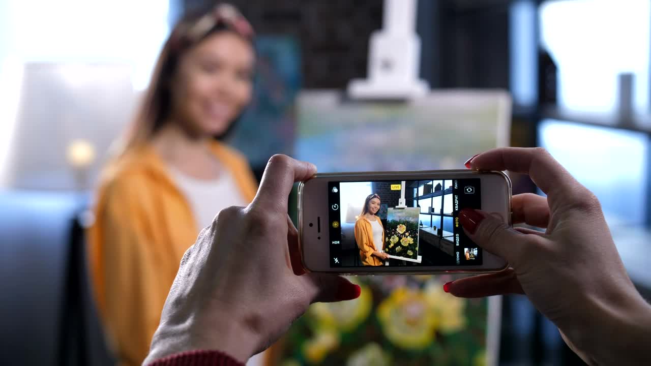 Free Video Stock taking a photo of an painter Live Wallpaper
