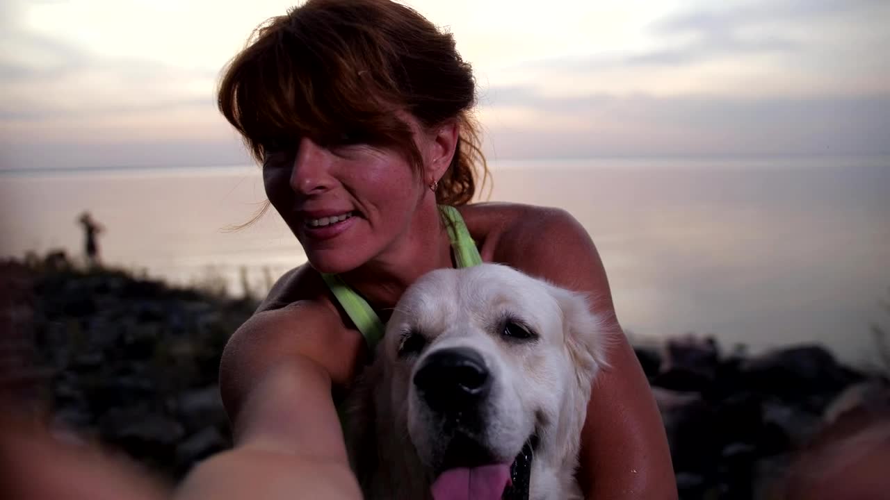 Free Video Stock taking a photo with her dog Live Wallpaper