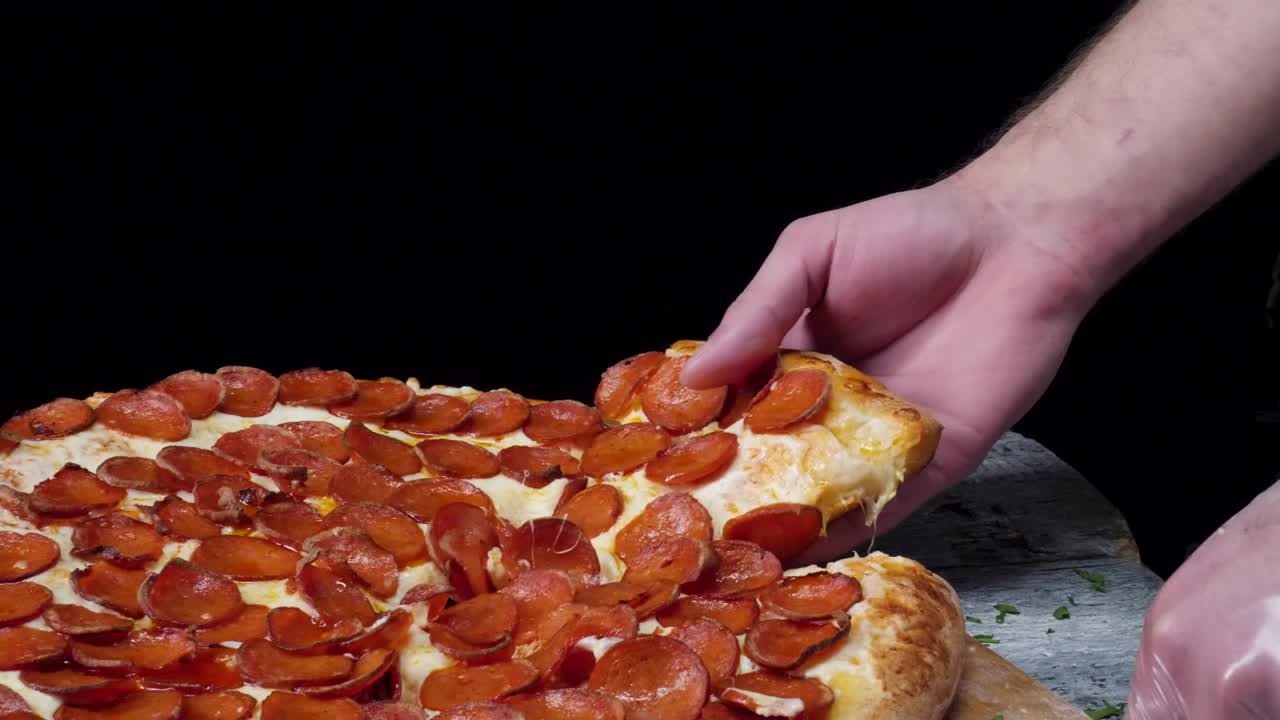 Free Video Stock taking a slice of fresh pizza Live Wallpaper
