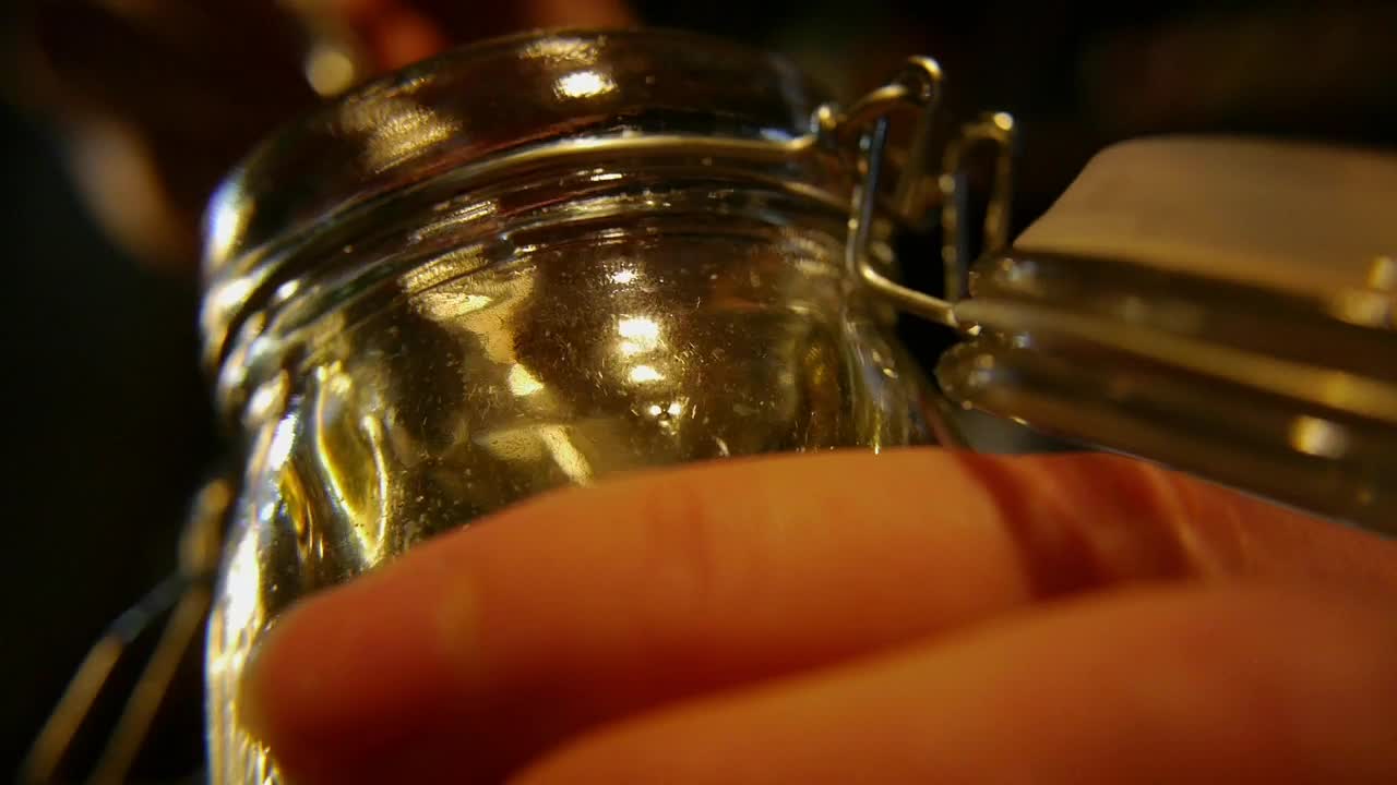 Free Video Stock taking honey out of the jar Live Wallpaper