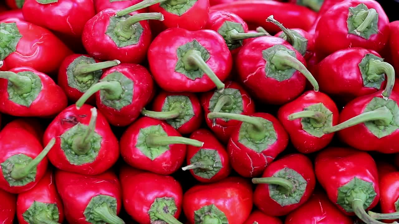 Free Video Stock taking some stacked red chillies Live Wallpaper