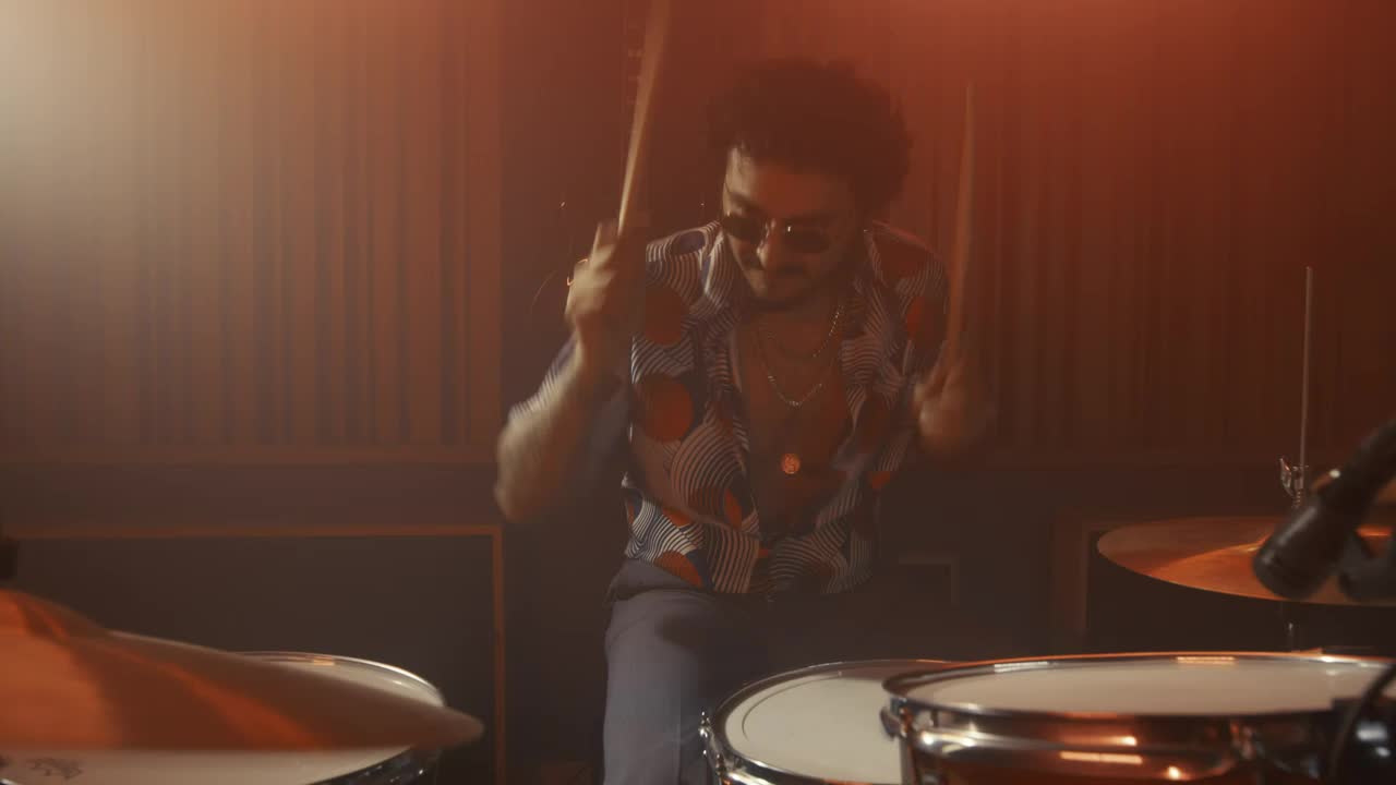 Free Video Stock talented drummer playing in a recording booth Live Wallpaper