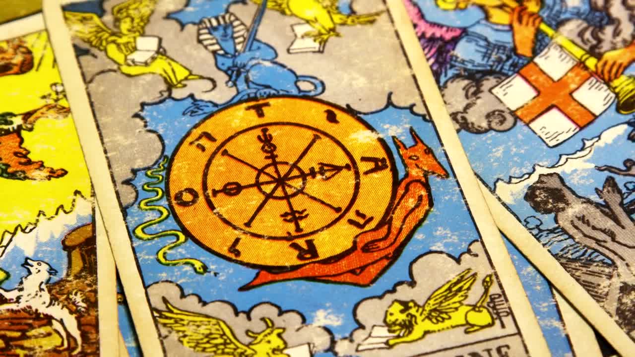 Free Video Stock tarot cards spread across a table Live Wallpaper
