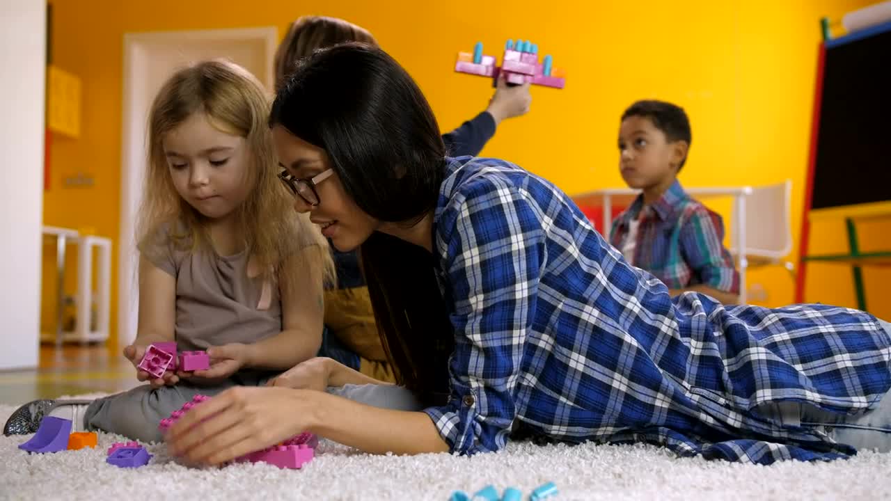 Free Video Stock teacher and students on a carpet playing Live Wallpaper