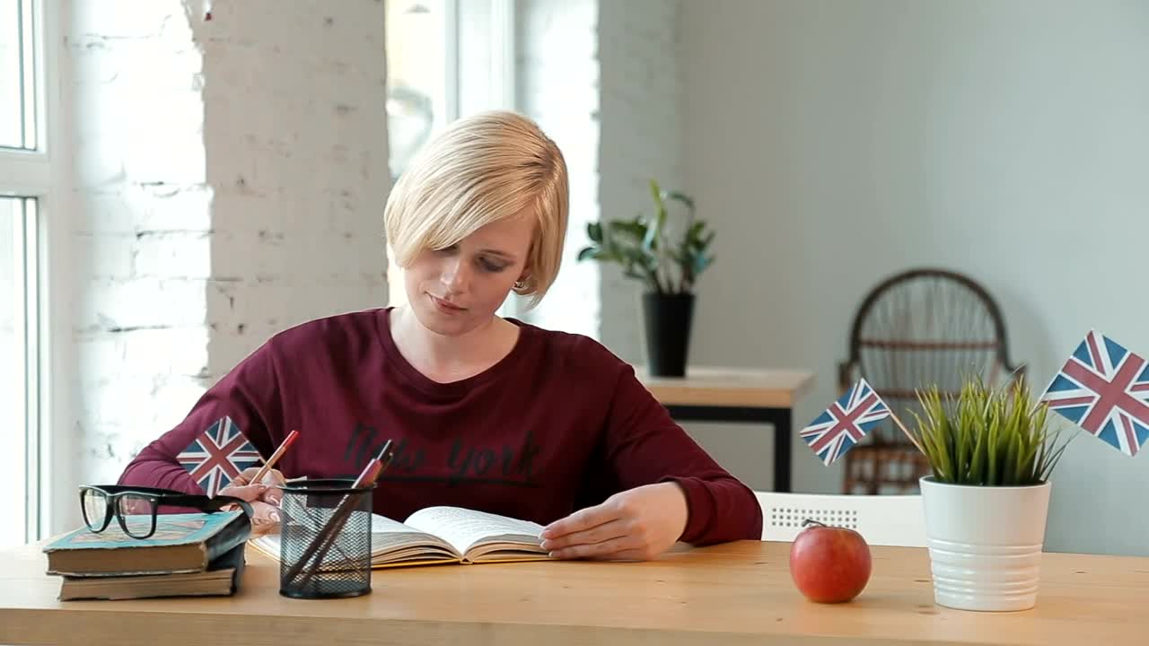 Free Video Stock teacher helps young student in classroom Live Wallpaper