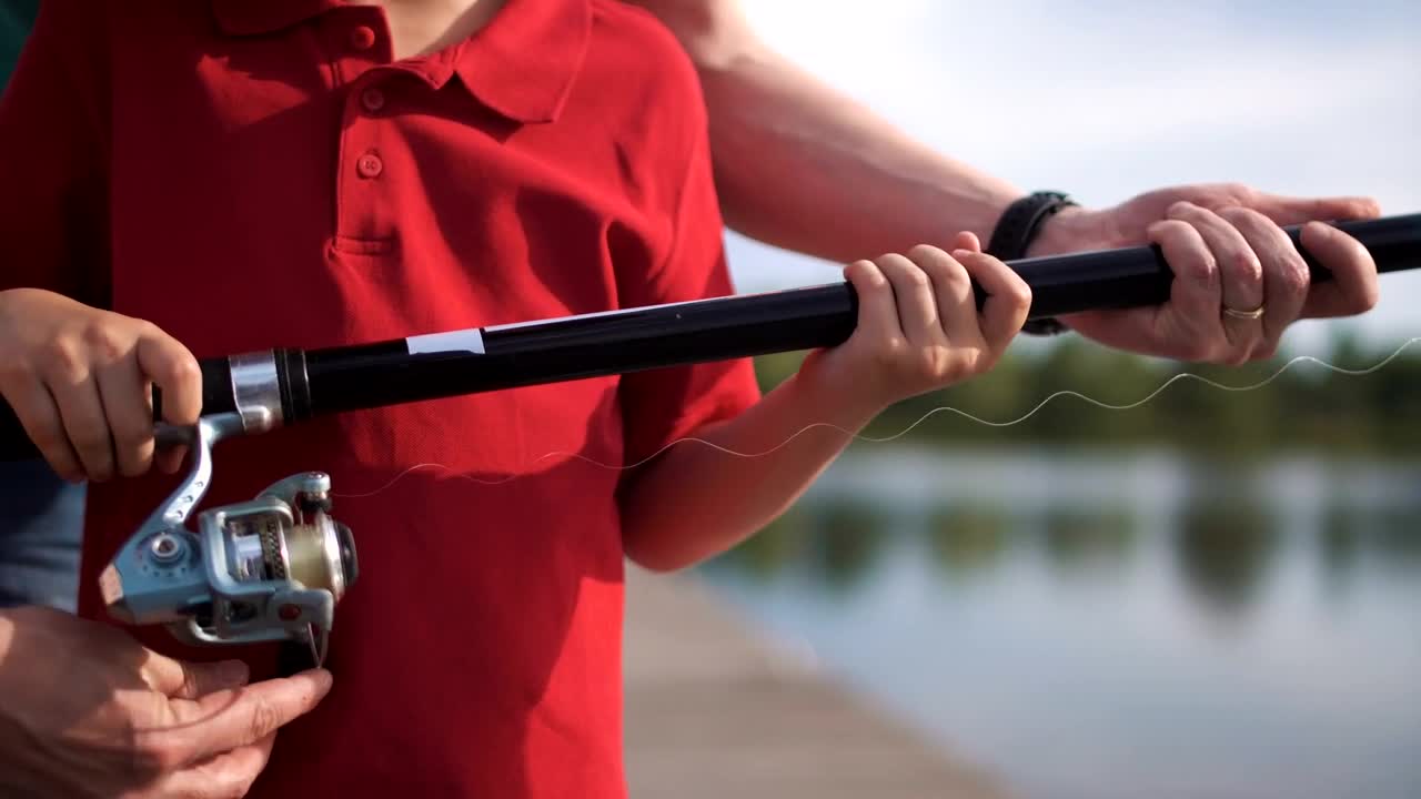 Free Video Stock teaching a kid how to fish in the lake Live Wallpaper
