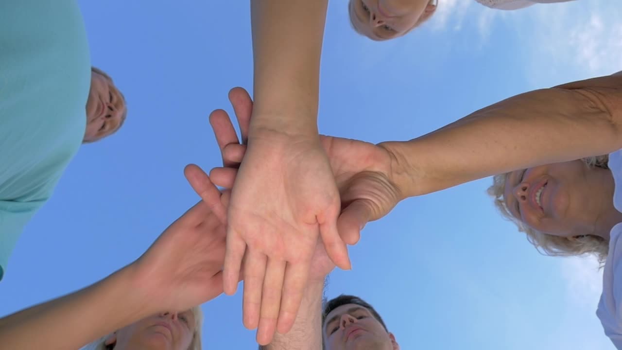 Free Video Stock team holding hands Live Wallpaper