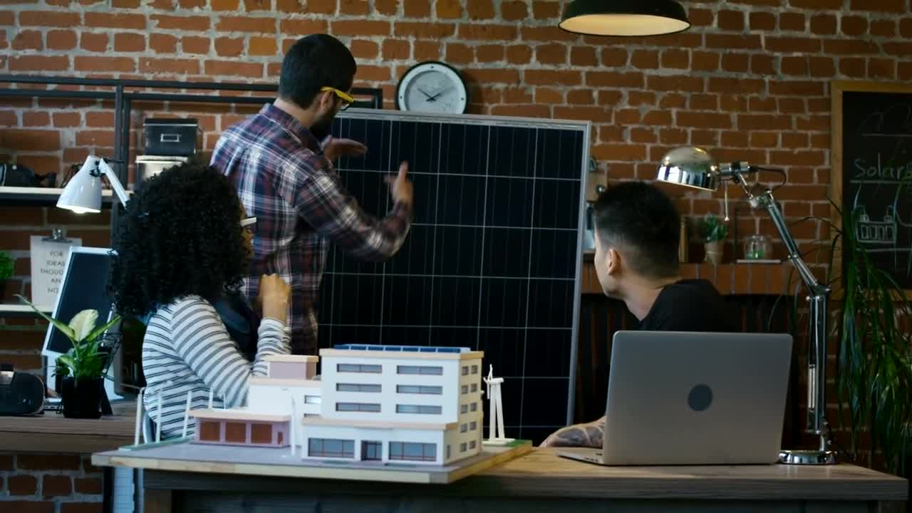 Free Video Stock team of architects reviewing a building model Live Wallpaper