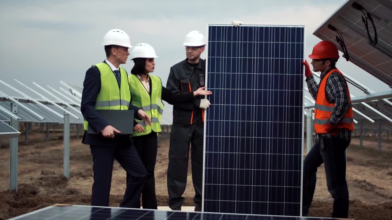 Free Video Stock team of engineers working with solar panels Live Wallpaper
