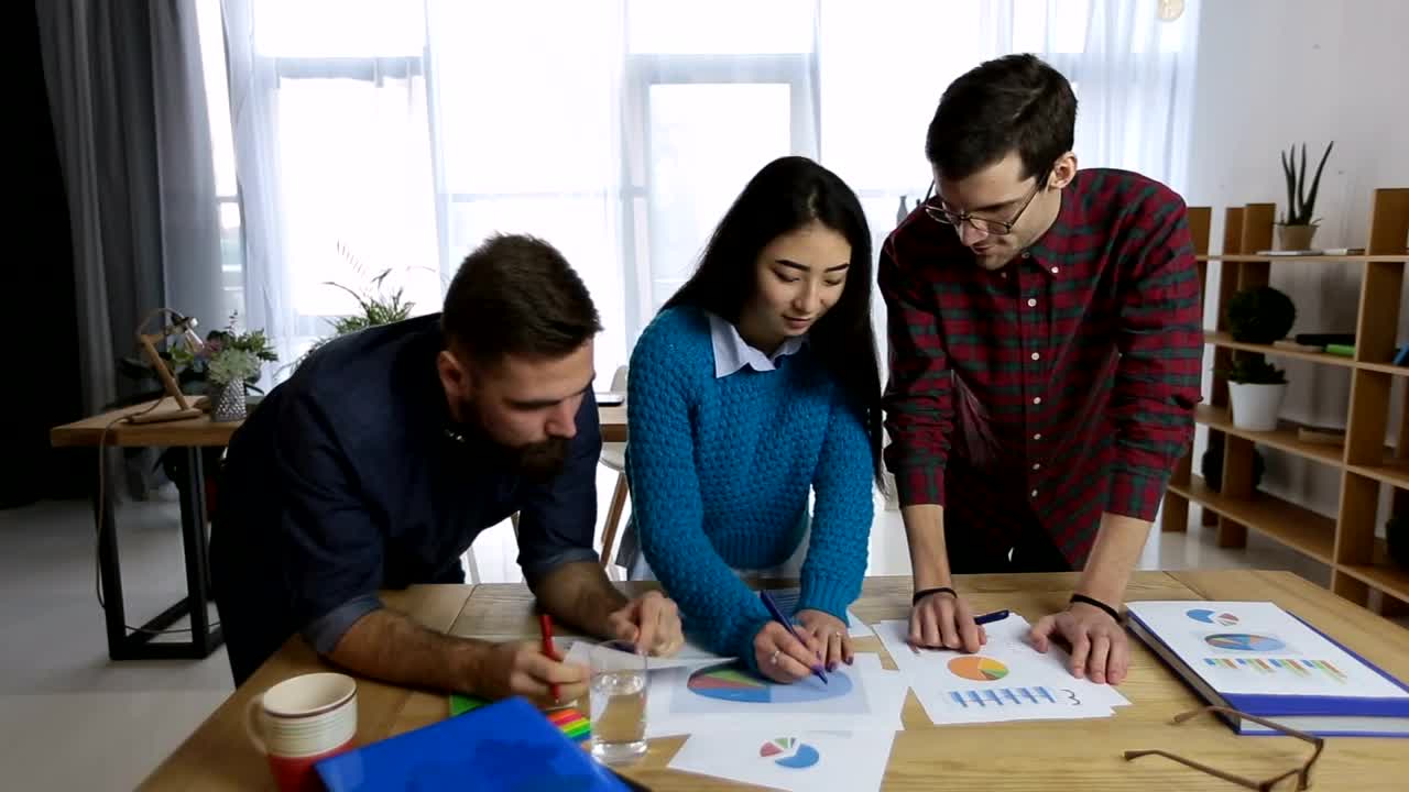 Free Video Stock team reviewing charts and reports Live Wallpaper