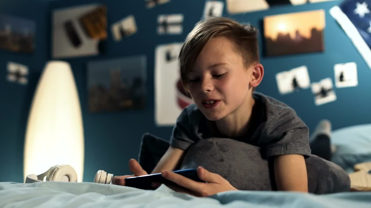 Free Video Stock teen boy chatting on the phone in the bedroom Live Wallpaper