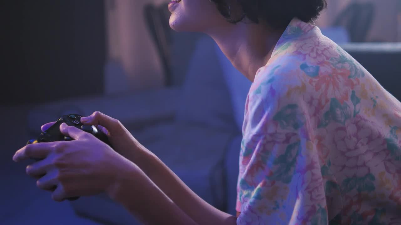 Free Video Stock teen playing video games in the living room Live Wallpaper