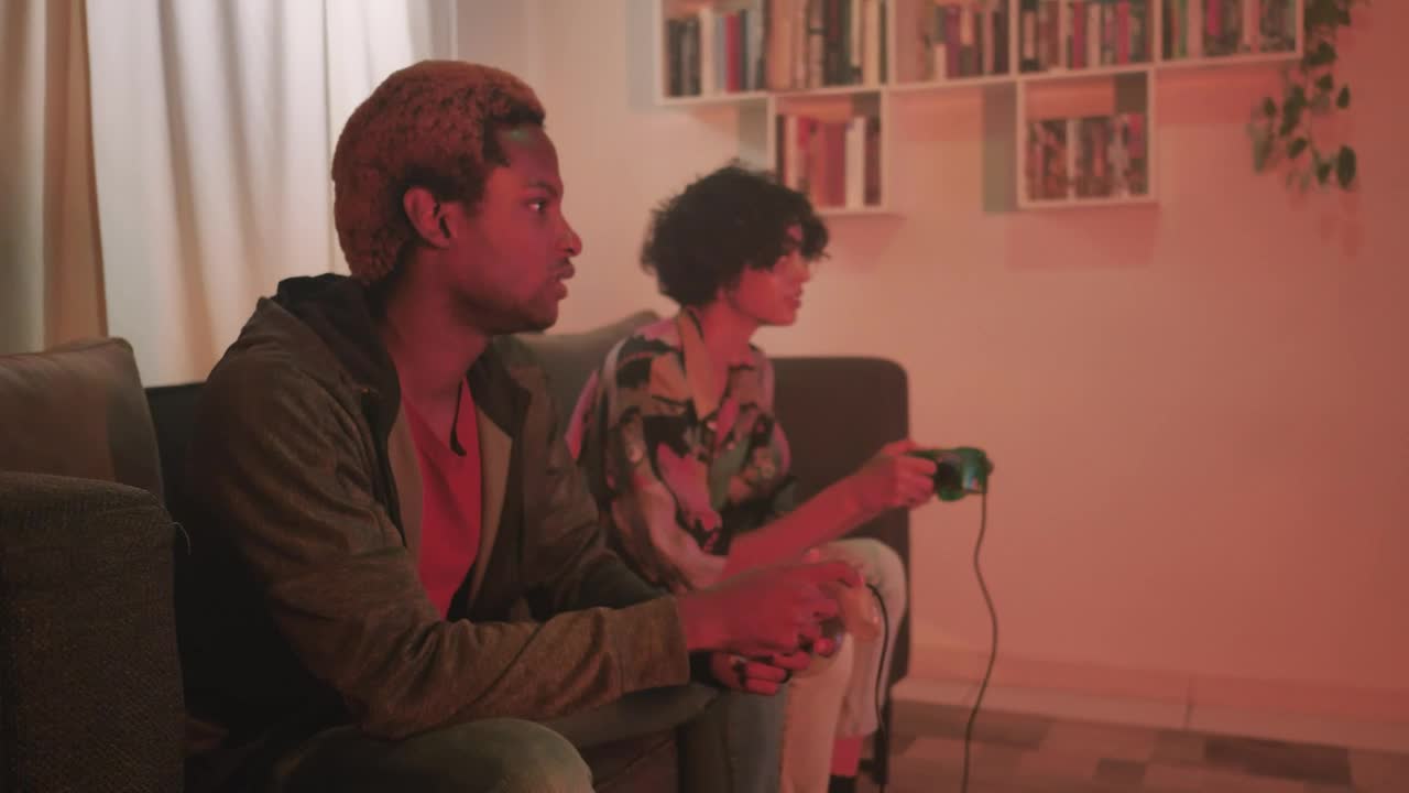 Free Video Stock teenage couple playing video games in the living room Live Wallpaper