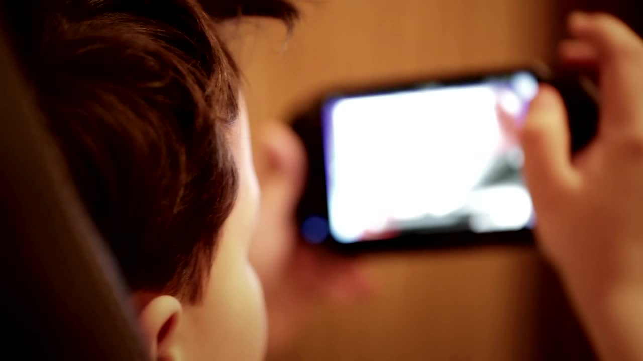 Free Video Stock teenager playing games in a chair Live Wallpaper