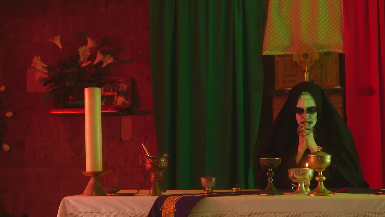 Free Video Stock terrifying ghost nun praying in a temple Live Wallpaper