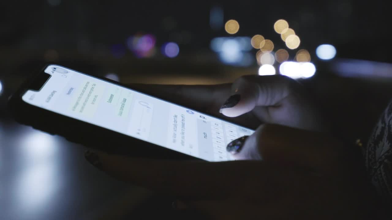 Free Video Stock texting on the street at night Live Wallpaper