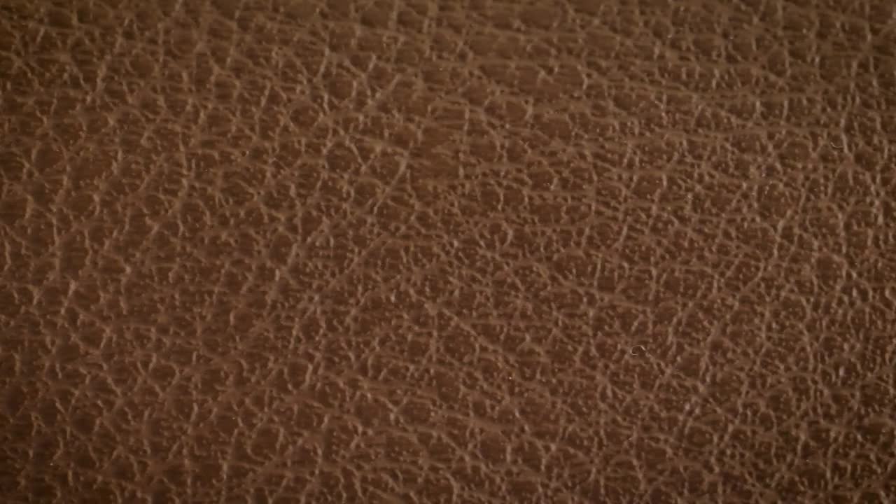 Free Video Stock texture of a brown leather surface close up Live Wallpaper