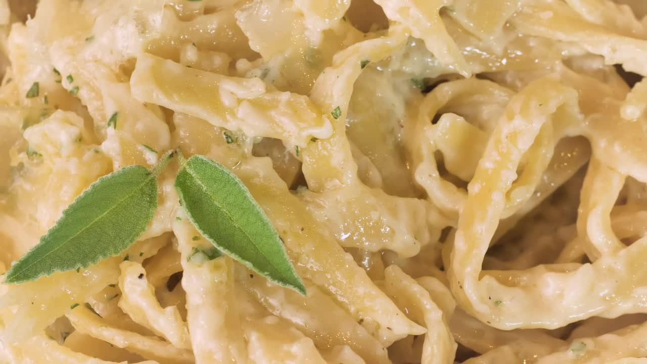 Free Video Stock texture of a fettuccine alfredo macro close up Live Wallpaper