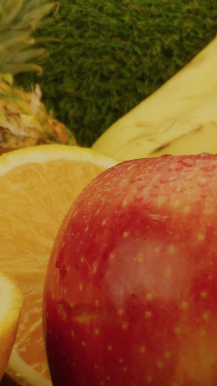 Free Video Stock texture of a lot of fruit on a green grass Live Wallpaper